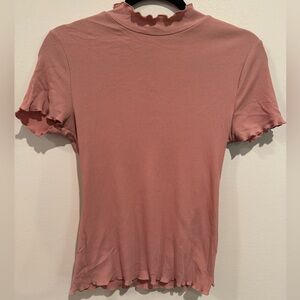 Dusty pink stretchy ribbed top with lettuce hem and mock neck